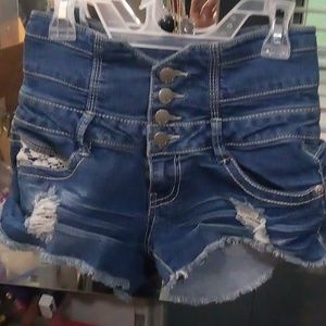 Junior mid-rise blue denim shorts four button threaded flowery  design on pocket